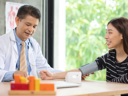 Doctor and female patient consulting