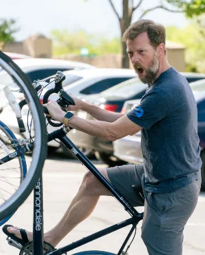 Smarty employee showing off his bike.