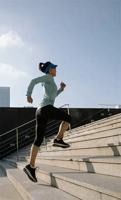 Athlete running up stairs