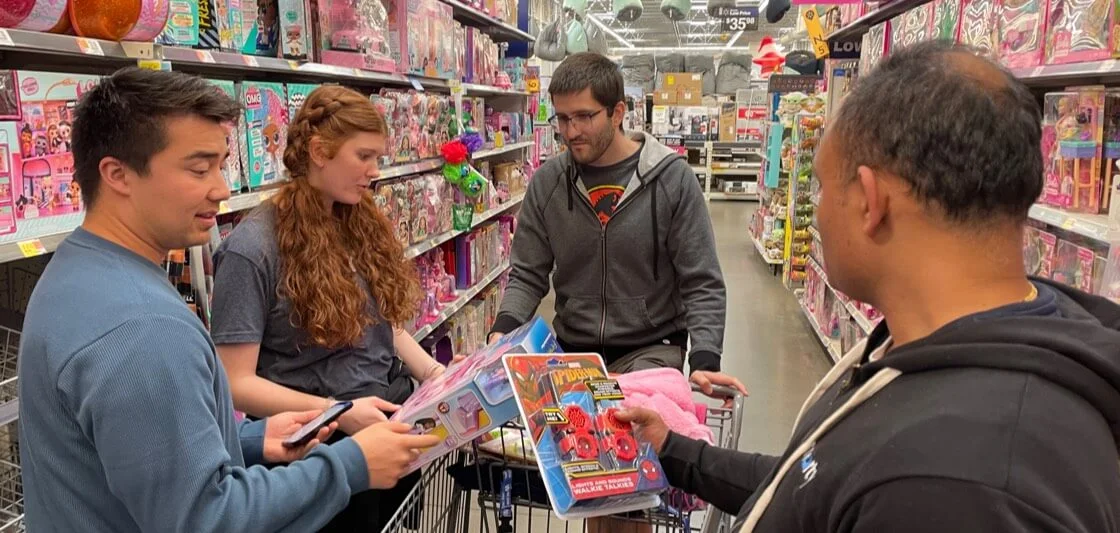 Smarty employees shop for toys for Sub for Santa