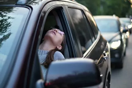 Woman stuck in traffic